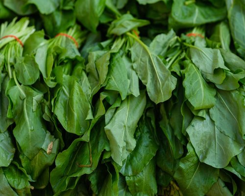 Fresh green leafy vegetables like spinach and bok choy