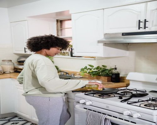 Person preparing a simple healthy meal in a cozy kitchen